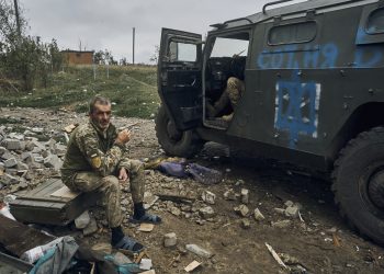 A Ukrainian soldier takes a break to rest. Credit:PA