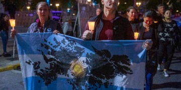 BUENOS AIRES, ARGENTINA - APRIL 02: A Malvinas war veteran and a woman hold an Argentinian flag with the Malvinas Islans drawed on April 2, 2022 in Buenos Aires, Argentina. Argentina commemorates the Argentine soldiers fallen during the Guerra de las Malvinas/Falklands Islands War on the 40th anniversary since the start of conflict against Great Britain over the sovereignty of the islands. (Photo by Ricardo Ceppi/Getty Images)