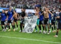 The Argentina players celebrate at full time with a banner that reads "The Falkland Islands are Argentinian" after the FIFA World Cup 2026 Semi Final match between England and Argentina at Atlanta Stadium (Getty Images)