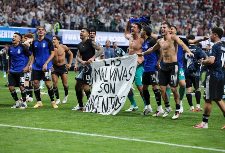 The Argentina players celebrate at full time with a banner that reads "The Falkland Islands are Argentinian" after the FIFA World Cup 2026 Semi Final match between England and Argentina at Atlanta Stadium (Getty Images)