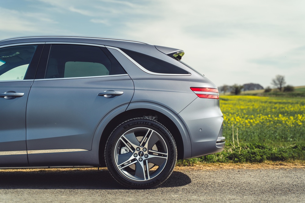 Rear quarter shot of the Genesis Electrified GV70 left-hand side