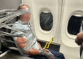 man duct taped to seat