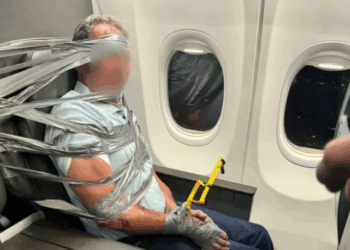 man duct taped to seat