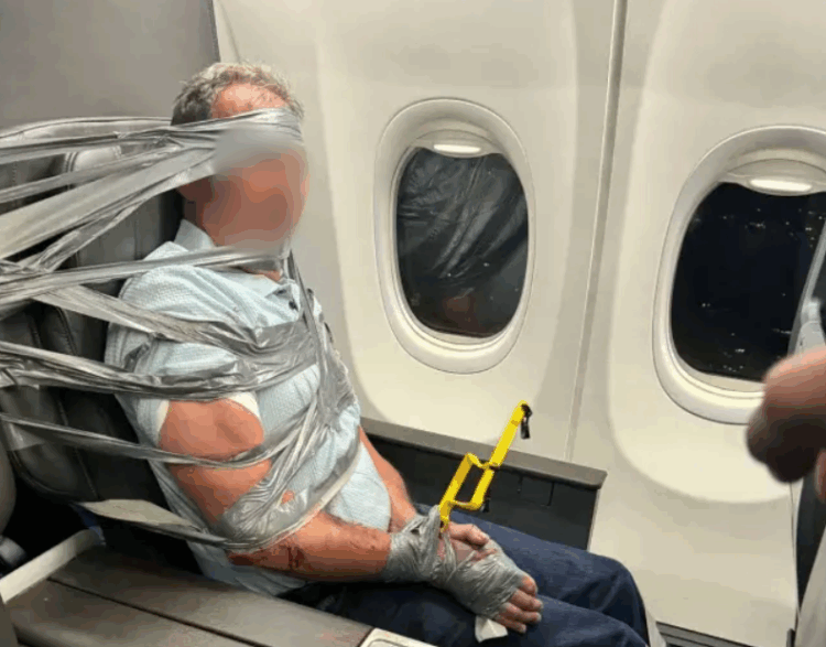 man duct taped to seat