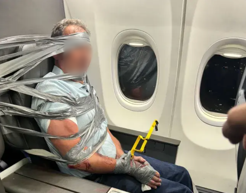 man duct taped to seat